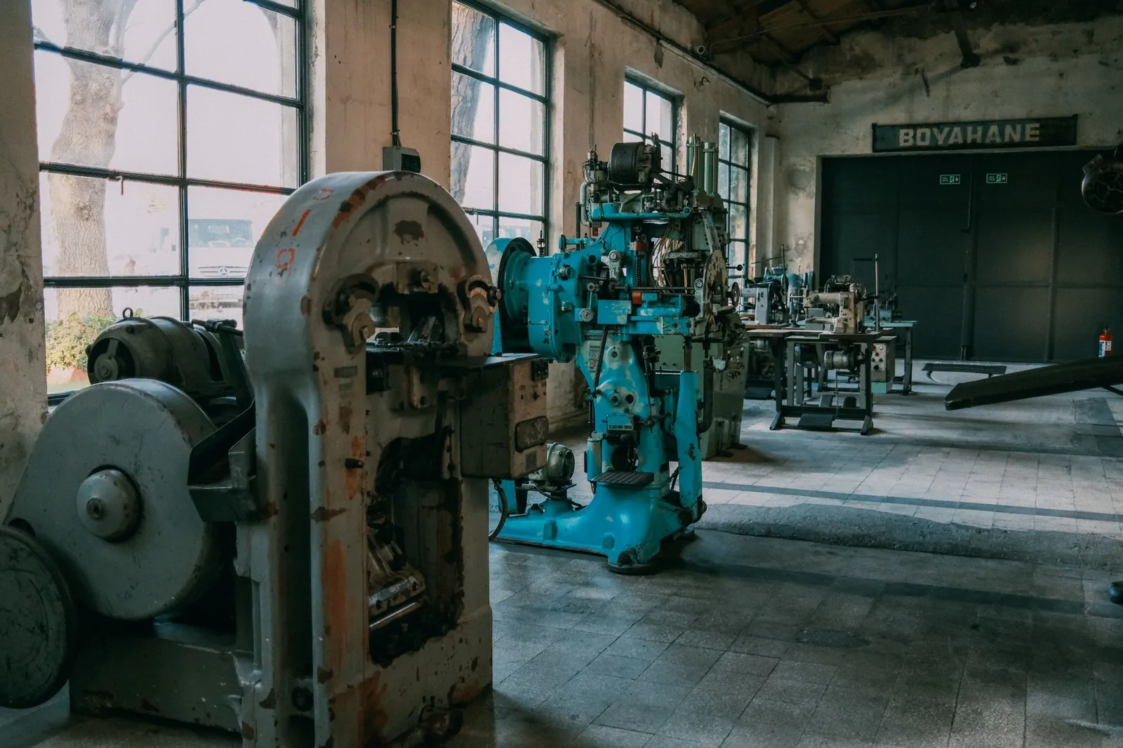 Interior of an old factory showcasing vintage machines and equipment. Stock photo illustrating Sigma Advanced Systems' new order story.