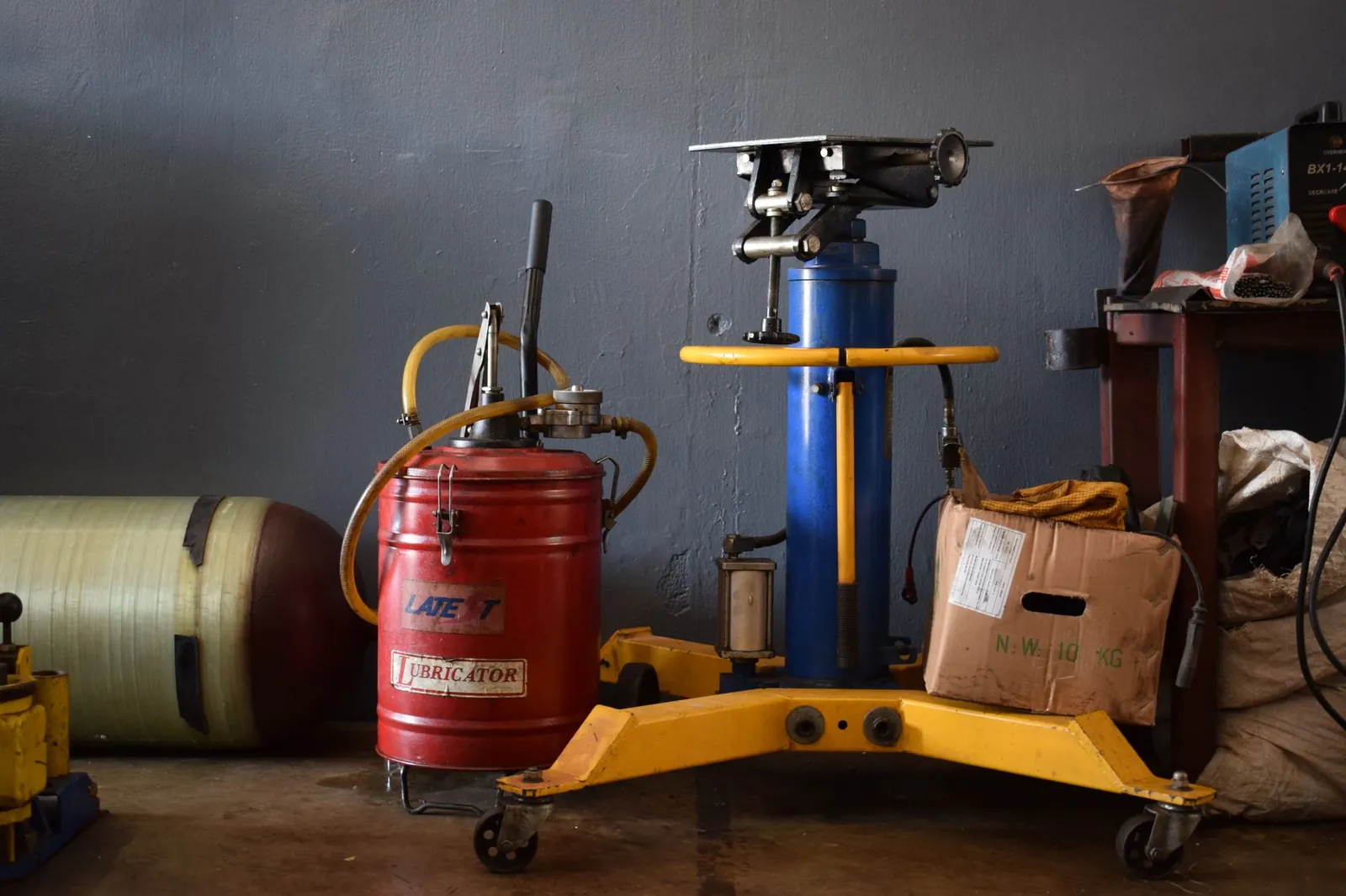 A well-equipped workshop features various machinery and an industrial lubricator. Stock photo illustrating Ecoboard Industries' new order story.