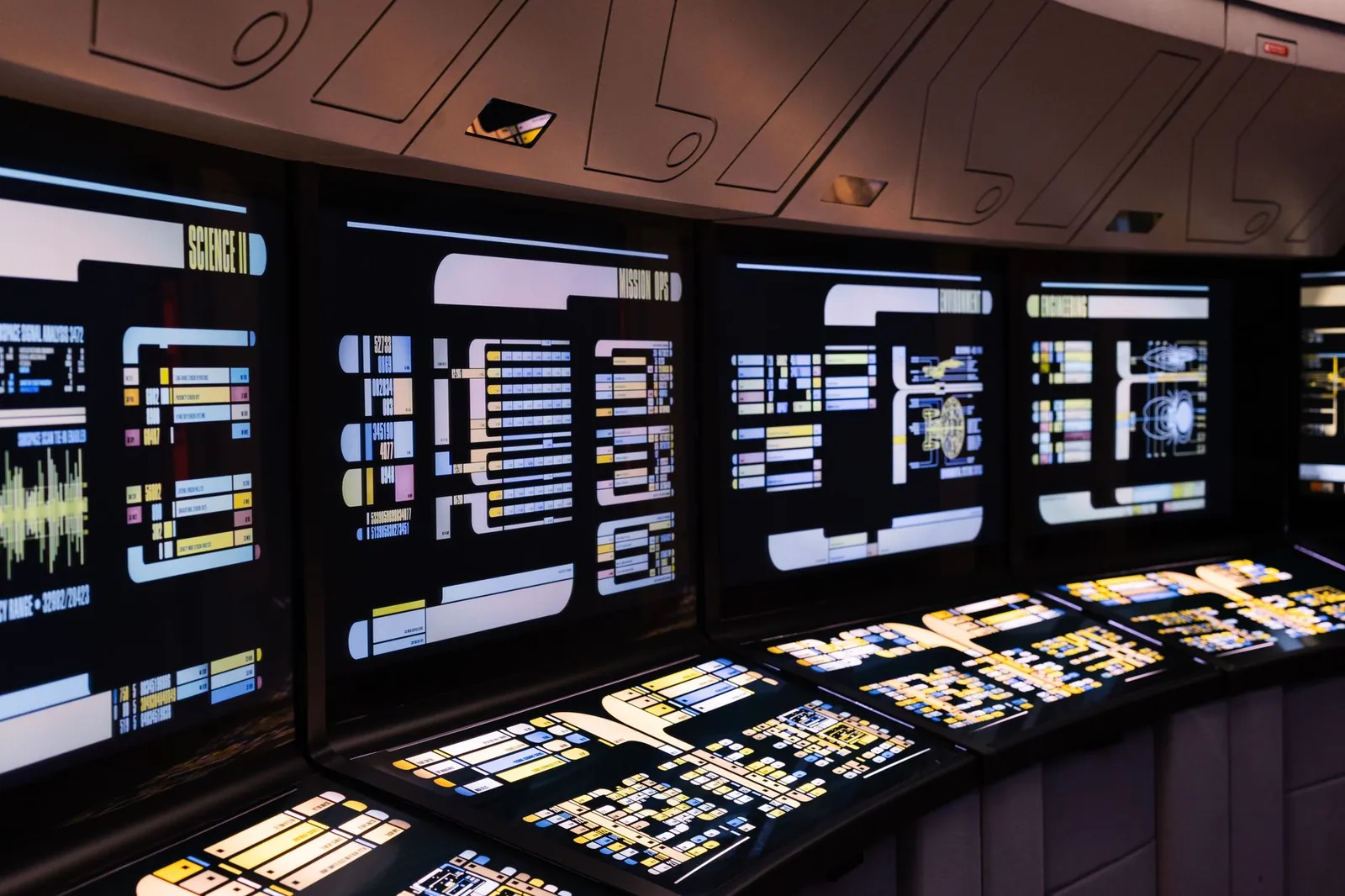 A high-tech command center with illuminated digital screens in a futuristic setting. Stock photo illustrating SoftTech Engineers' new order story.