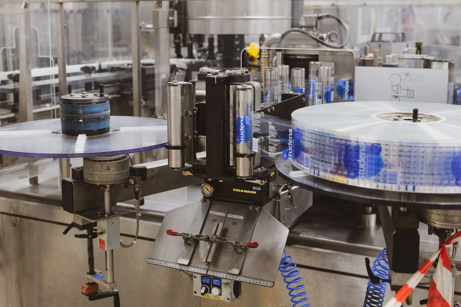 Close-up of automated machinery in a Lipik factory's production line. Stock photo illustrating Kabra Extrusiontechnik's fund raise story.