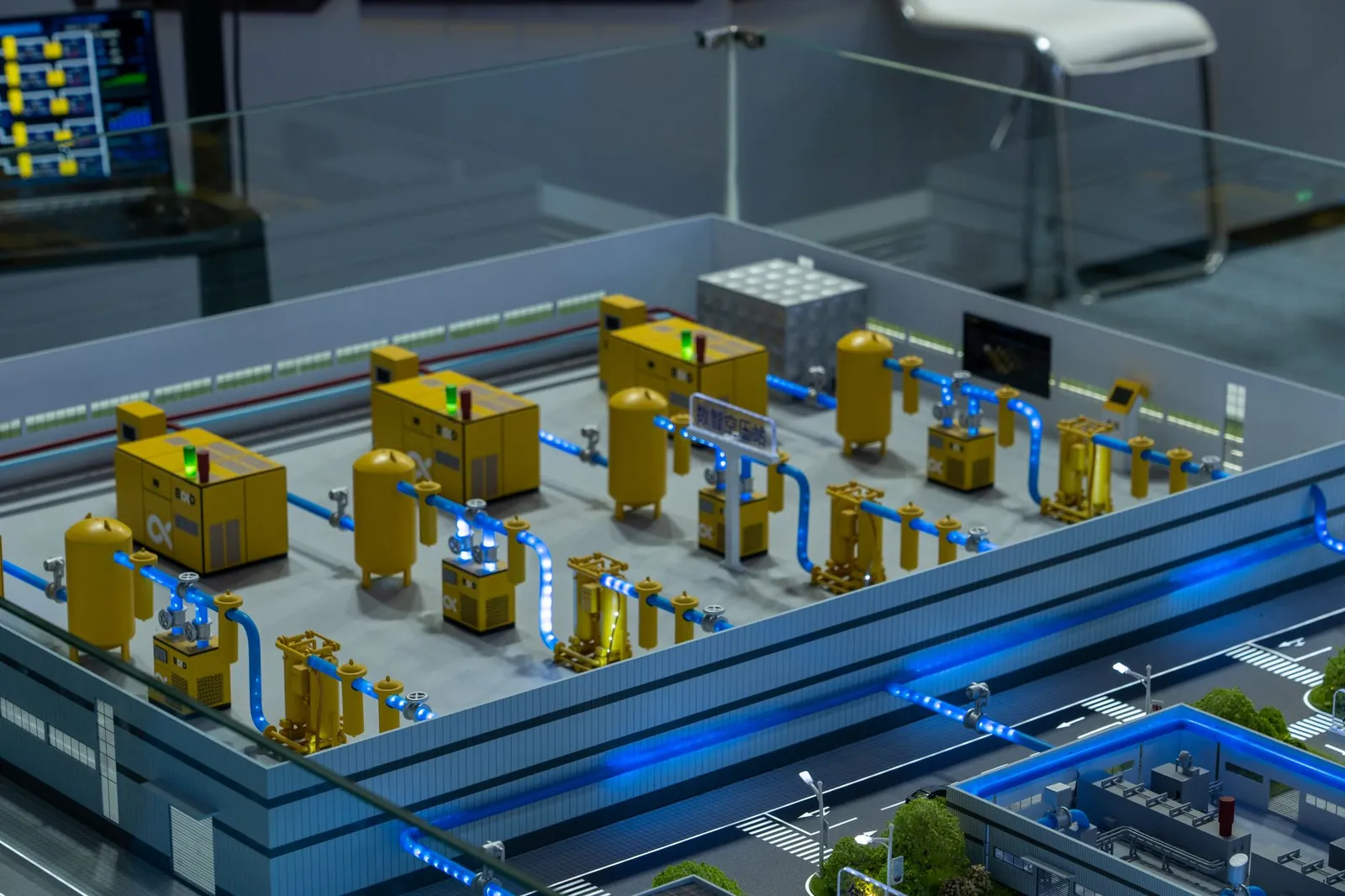 Detailed industrial model display showcasing machinery and systems indoors, emphasizing technology and design. Stock photo illustrating Marine Electricals (India)'s new order story.