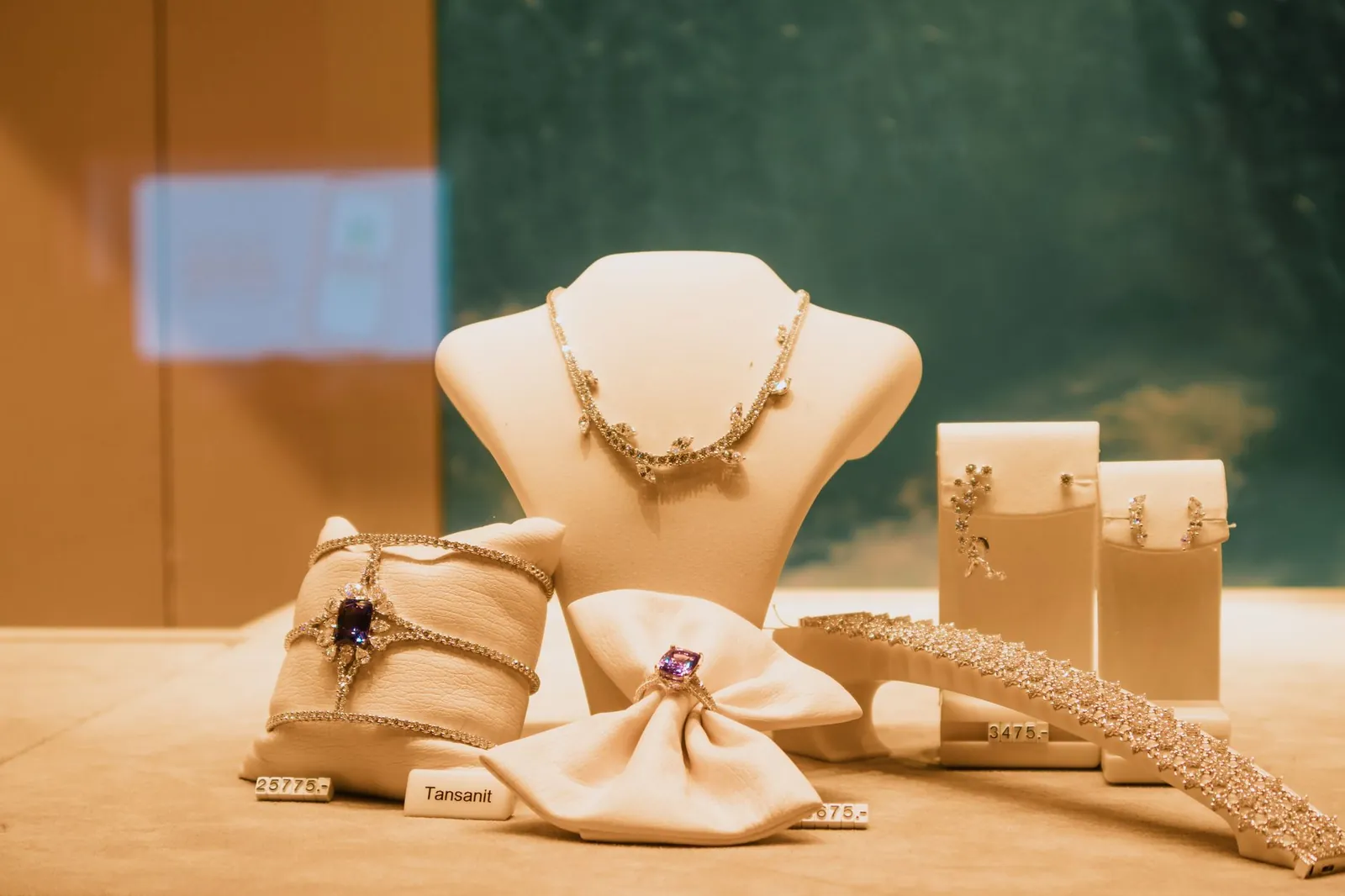 Luxury jewelry display with tansanit and diamond pieces in a store. Stock photo illustrating PNGS Reva Diamond Jewellery's product launched story.