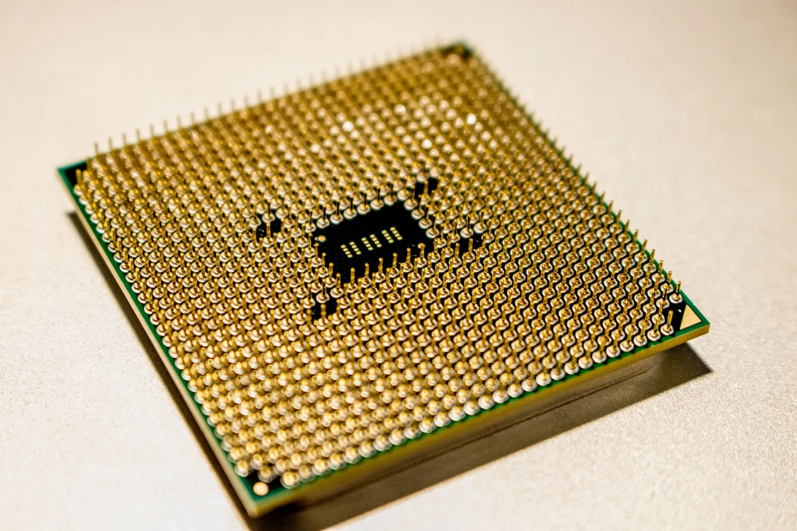 Detailed close-up of a golden microprocessor chip, ideal for technology concepts. Stock photo illustrating Larsen & Toubro's product launched story.