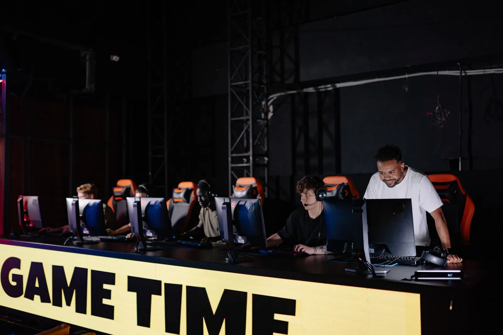 Esports team engaged in competitive gaming session indoors, showcasing teamwork and concentration. Stock photo illustrating Nazara Technologies' product launched story.
