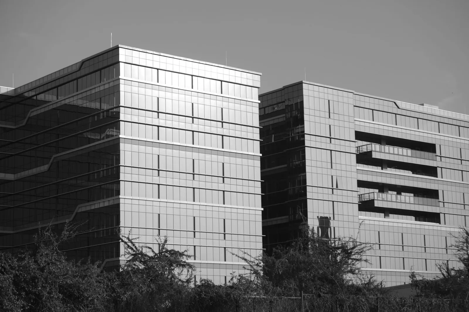 Black and white photo of modern office buildings in Bengaluru, India, showcasing architectural design. Stock photo illustrating Vascon Engineers' new order story.