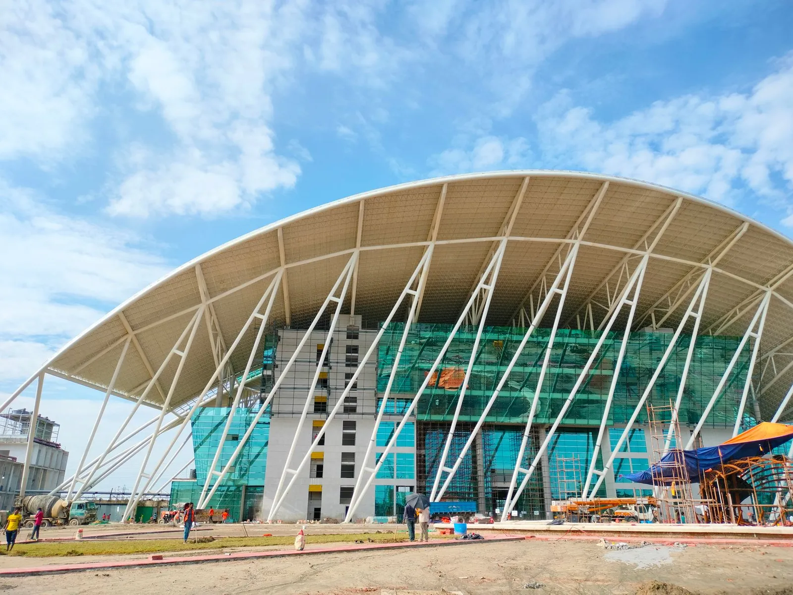 Contemporary building with unique design under construction in Bangalore, India. Stock photo illustrating KMC Speciality Hospitals (India)'s expansion story.