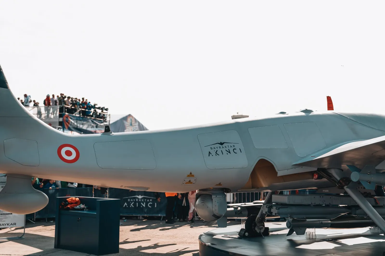 Bayraktar Akinci drone displayed at a busy airshow with spectators. Stock photo illustrating Zen Technologies' product launched story.