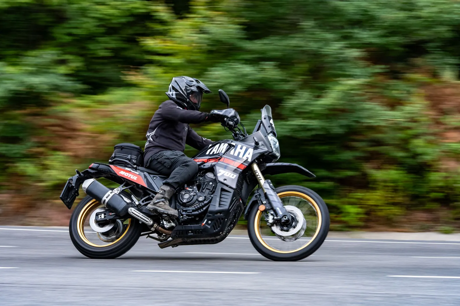Dynamic shot of a motorcyclist riding an adventure bike on a road. Stock photo illustrating TVS Motor Company's product launched story.