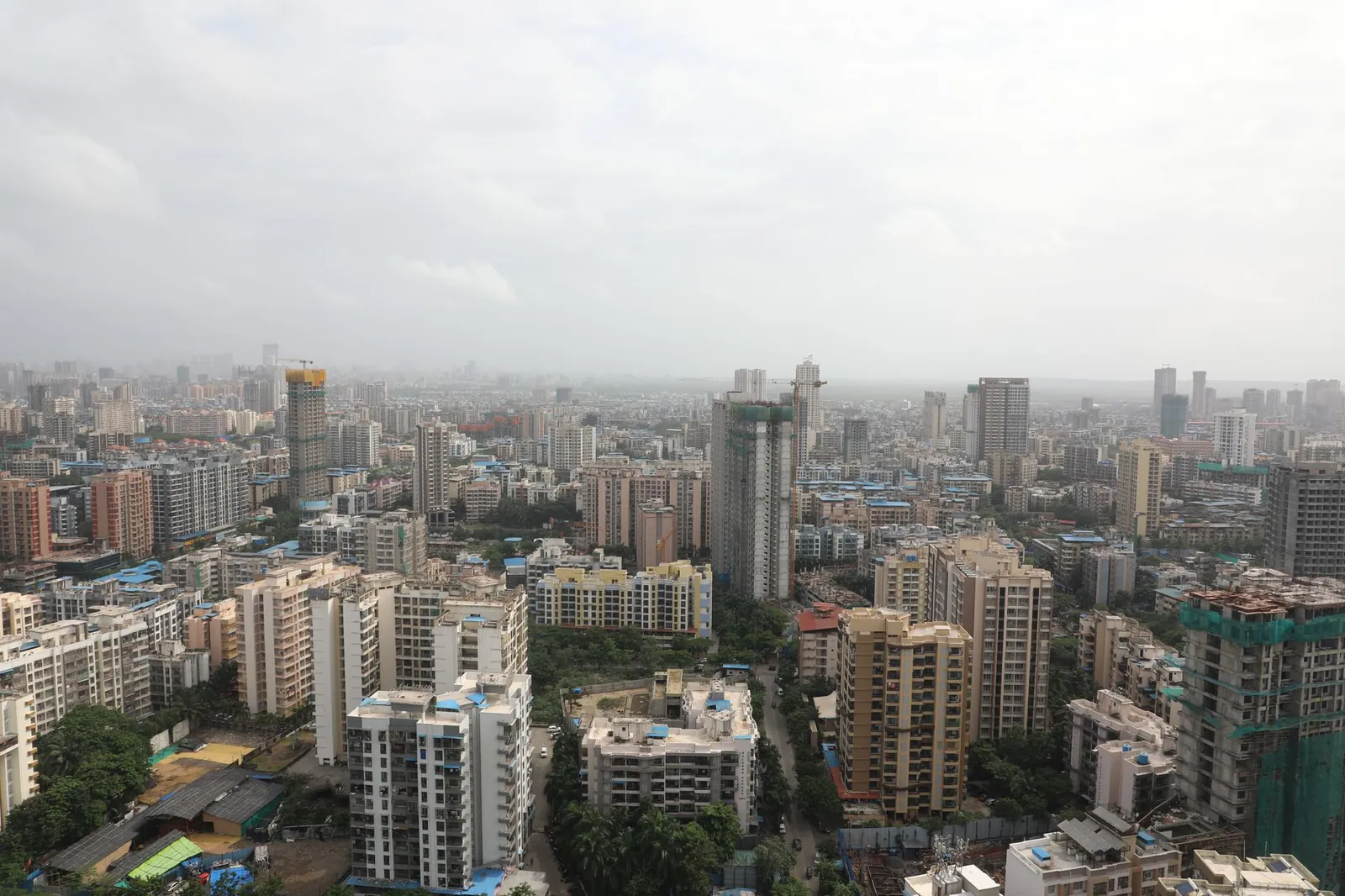 Vast urban skyline filled with high-rise buildings and cloudy sky. Stock photo illustrating Puravankara's product launched story.