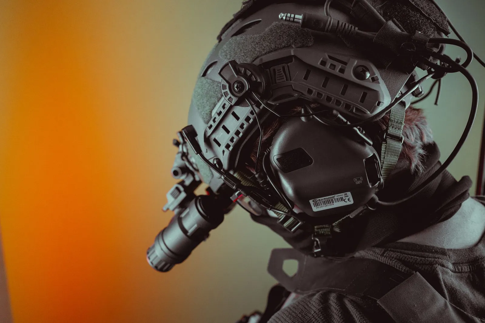 Close-up of a tactical helmet equipped with night vision gear, emphasizing technology. Stock photo illustrating Neueon Corporation's new order story.