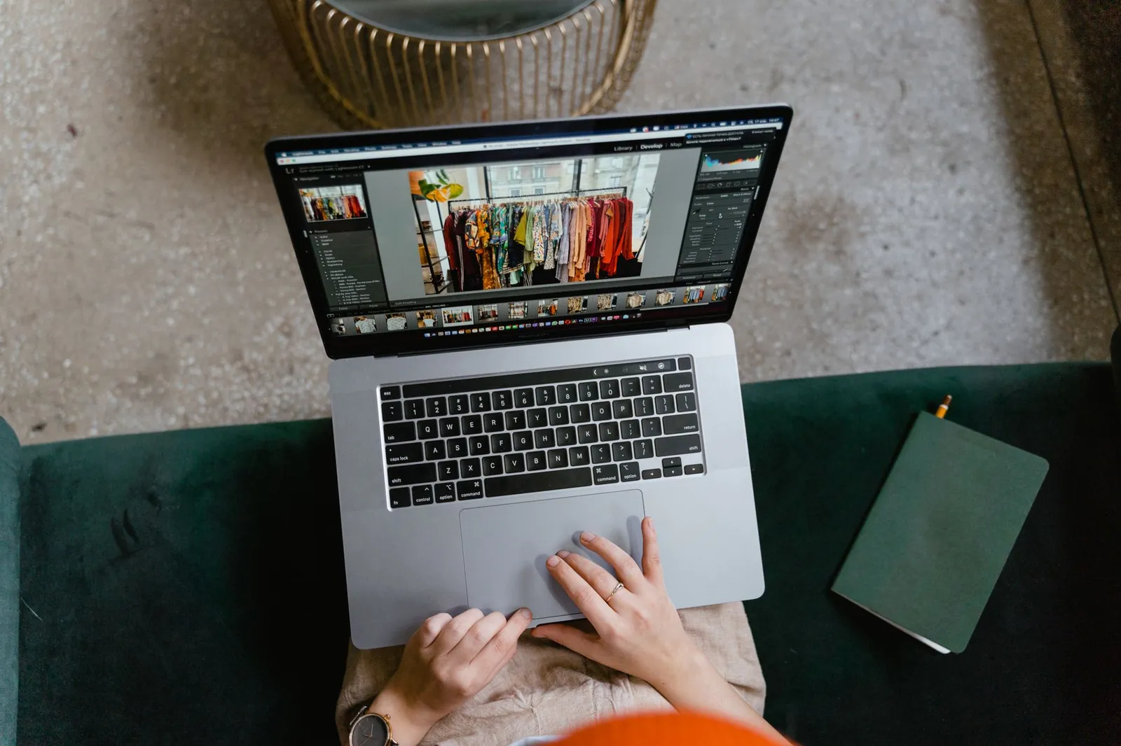 Person editing clothing photos on a laptop indoors, showcasing online fashion business or e-commerce work. Stock photo illustrating Thomas Scott (India)'s earning call story.