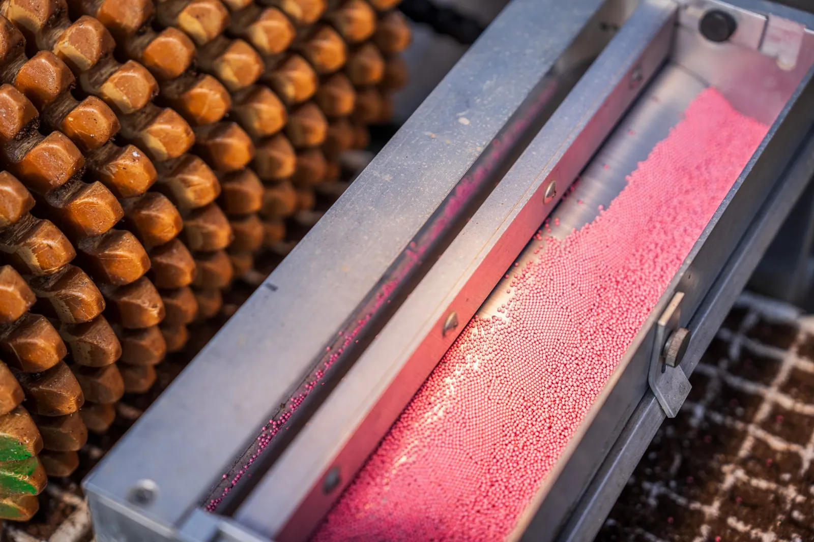 Close-up of industrial machinery with pink ball bearings and metal equipment. Stock photo illustrating Schaeffler India's earning call story.