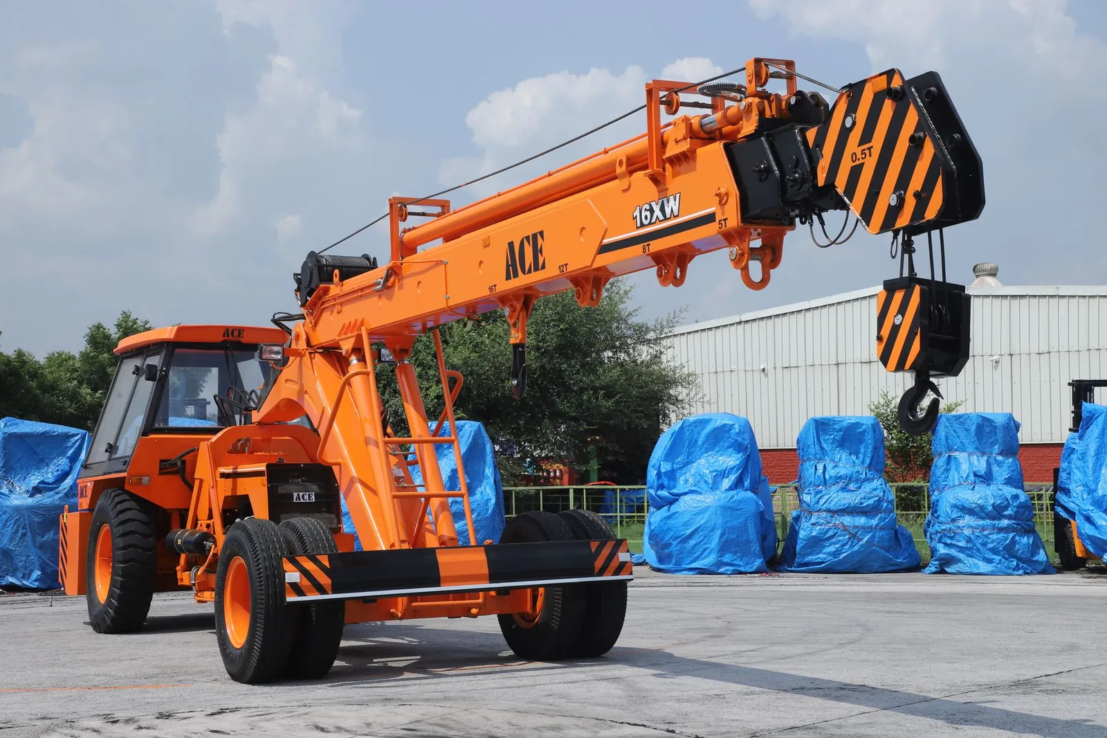 ACE 16XW hydraulic crane at a construction site in Faridabad, India. Stock photo illustrating Bondada Engineering's fund raise story.