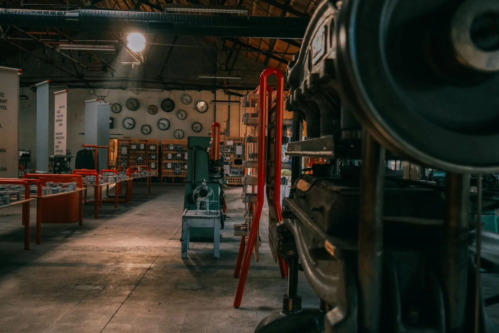 A rustic industrial workshop filled with vintage machinery and tools. Stock photo illustrating Neueon Corporation's fund raise story.