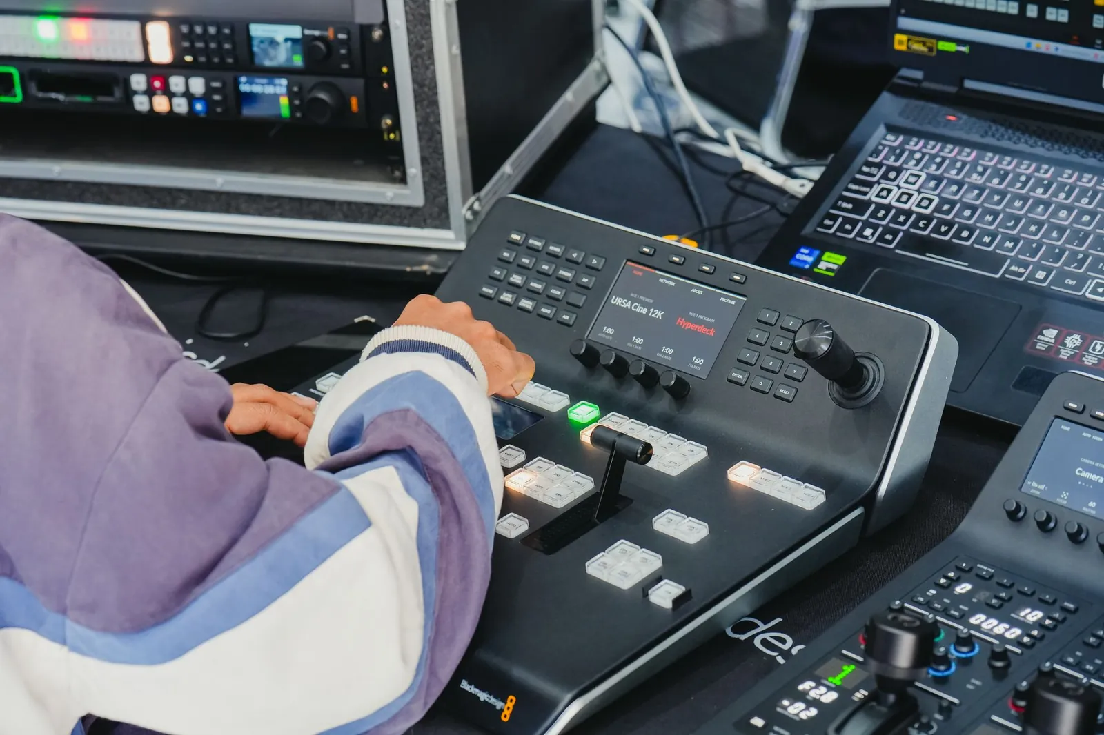 Operator managing video switcher in a professional control room with advanced equipment. Stock photo illustrating Amagi Media Labs' product launched story.