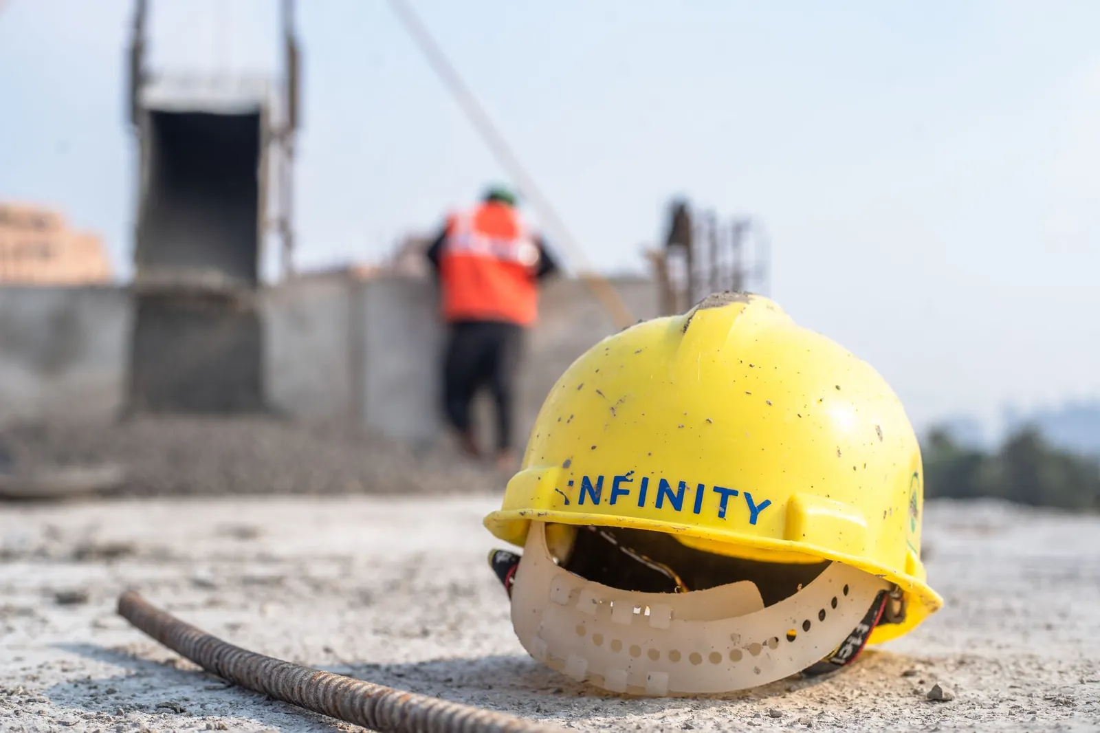 Close-up of a yellow safety helmet on a construction site in Delhi. Stock photo illustrating Z-Tech (India)'s earning call story.
