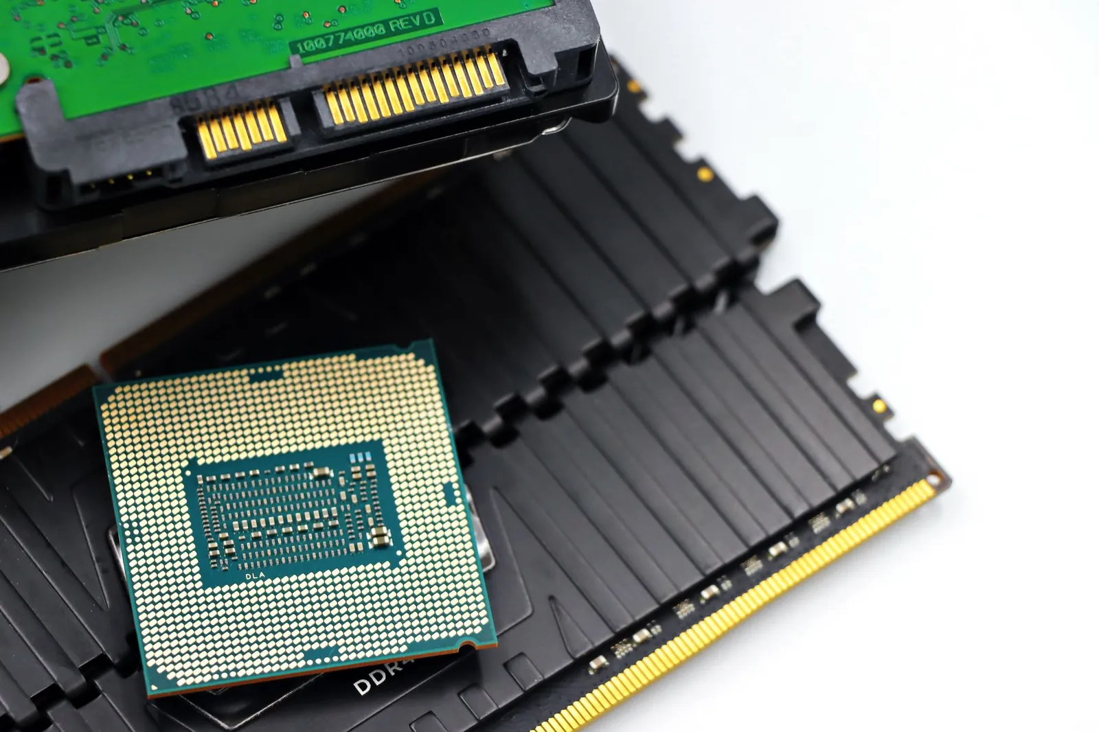 Detailed view of a CPU chip and RAM modules, illustrating computer hardware components. Stock photo illustrating GNG Electronics' earning call story.