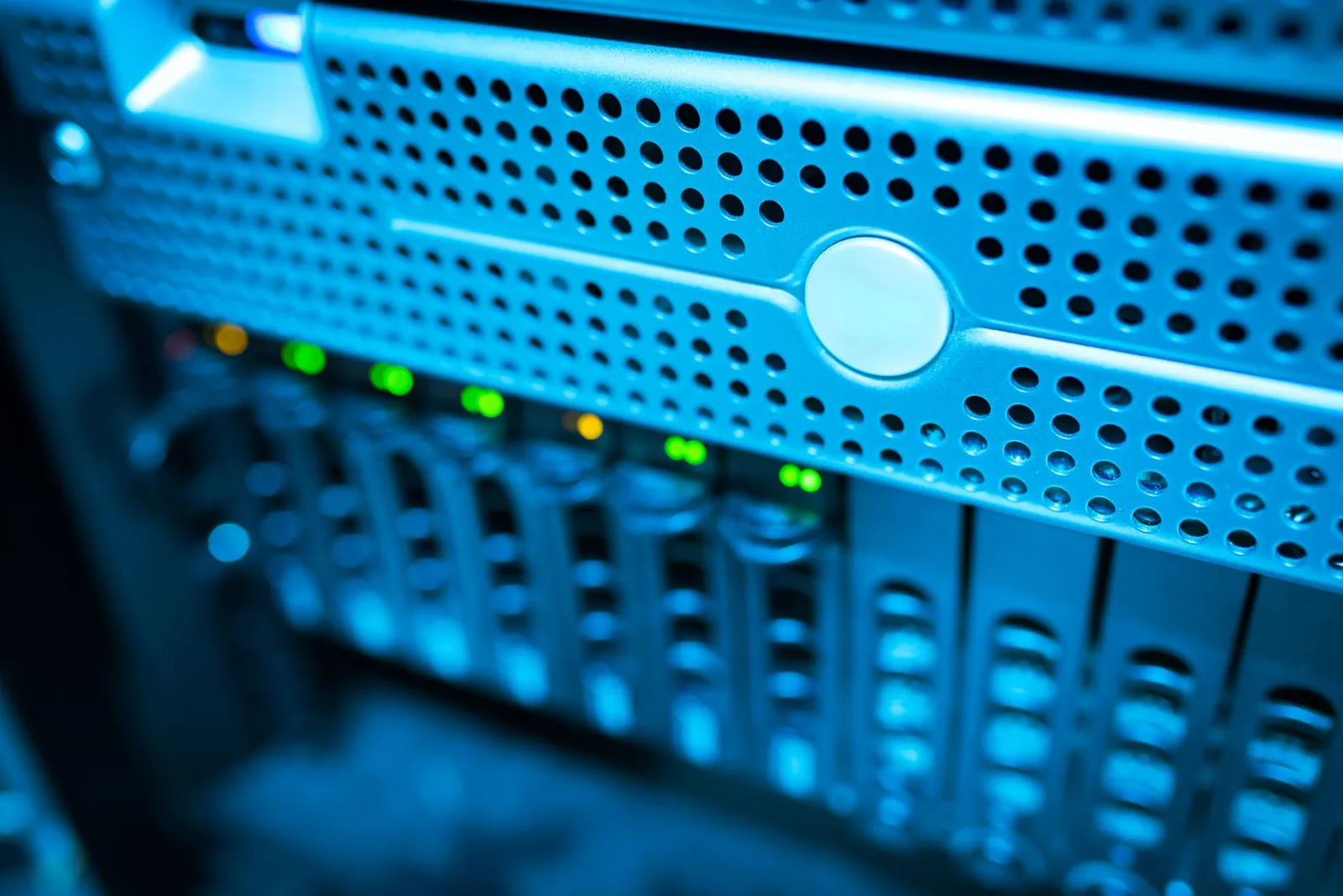 Focused view of a modern data server rack with blinking lights in a blue-lit environment. Stock photo illustrating LTM's product launched story.