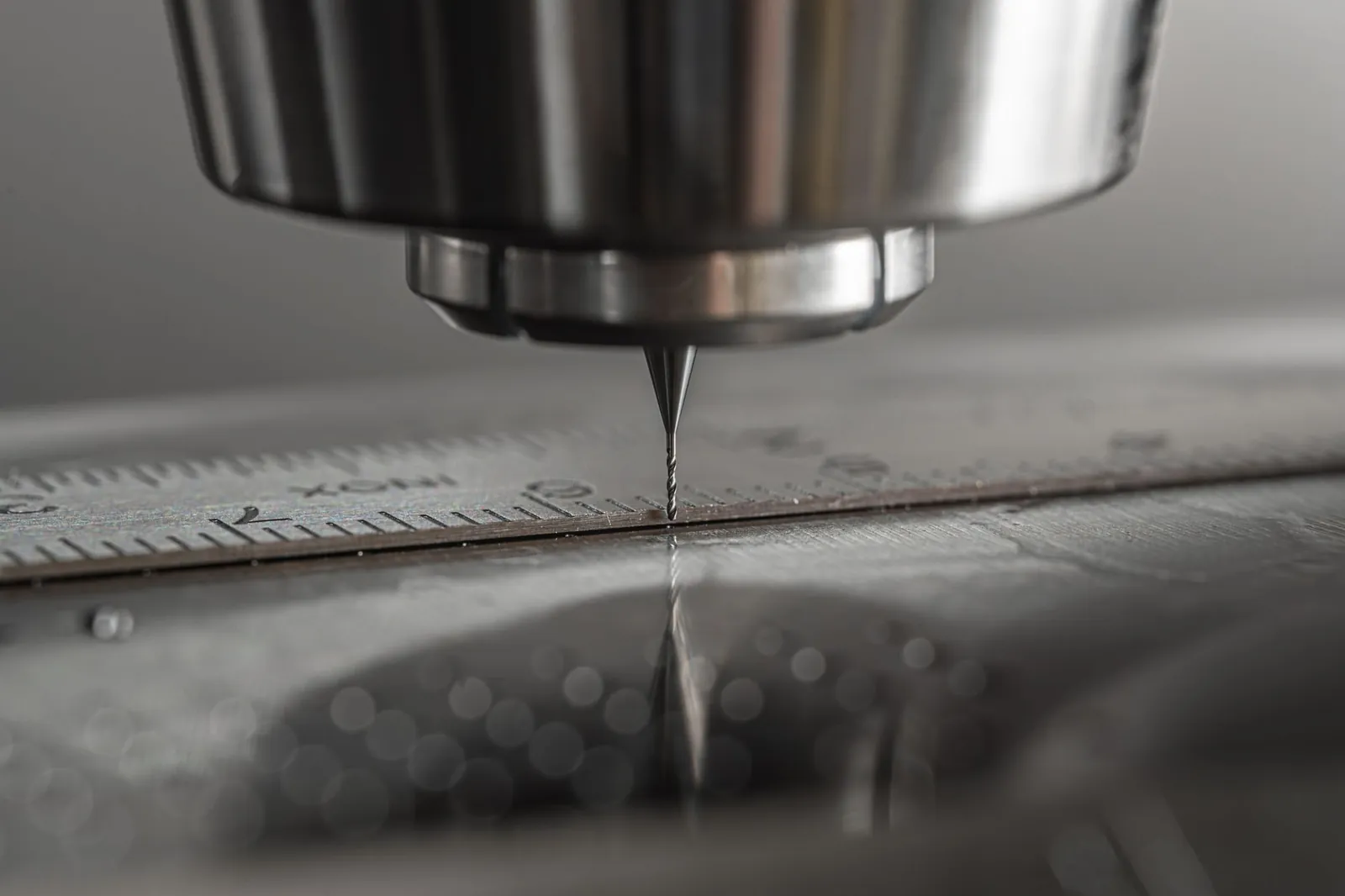 Detailed close-up of a CNC milling machine working on metal, showcasing precision and industry technology. Stock photo illustrating OBSC Perfection's partnership story.