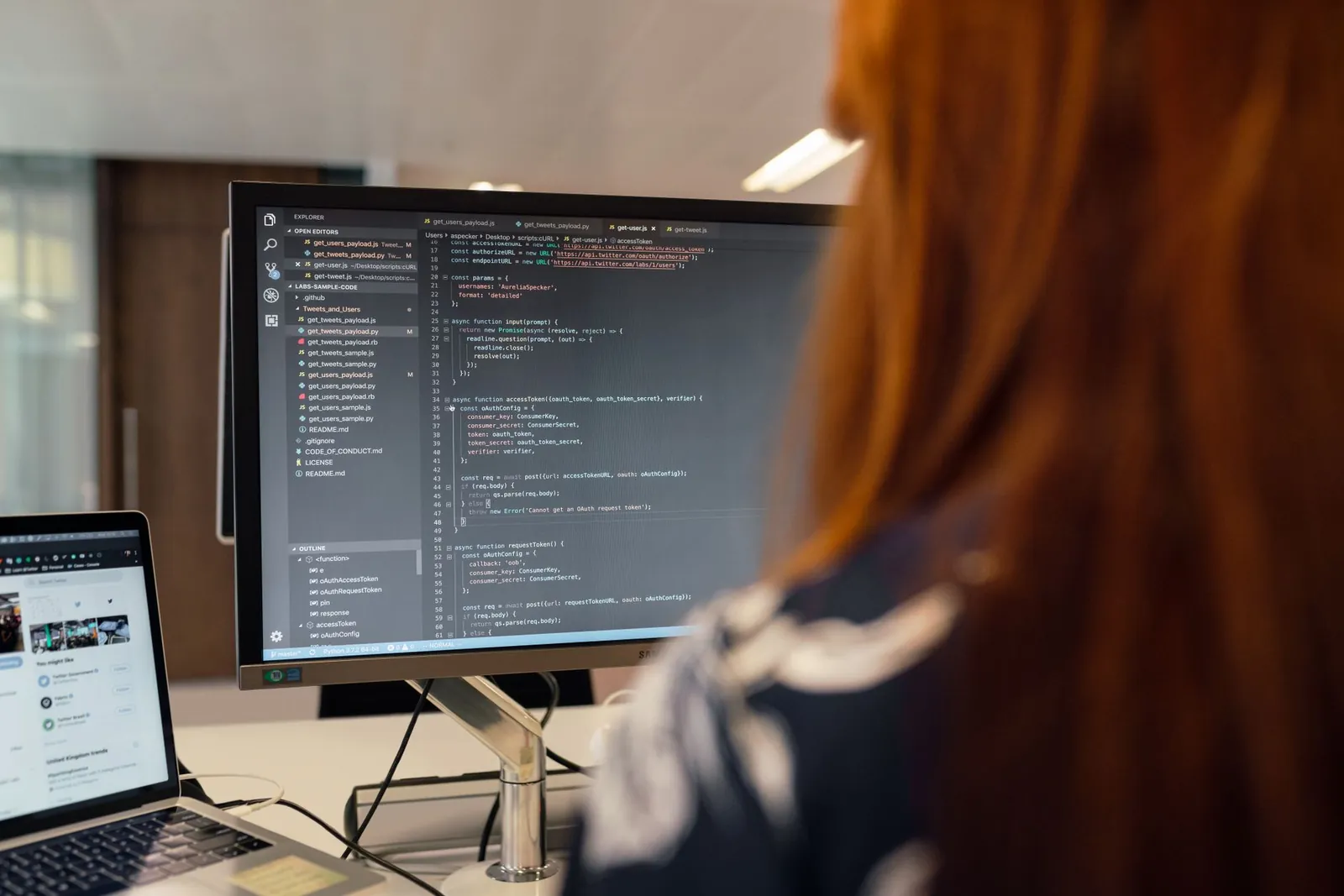 A female engineer works on code in a contemporary office setting, showcasing software development. Stock photo illustrating Mastek's product launched story.
