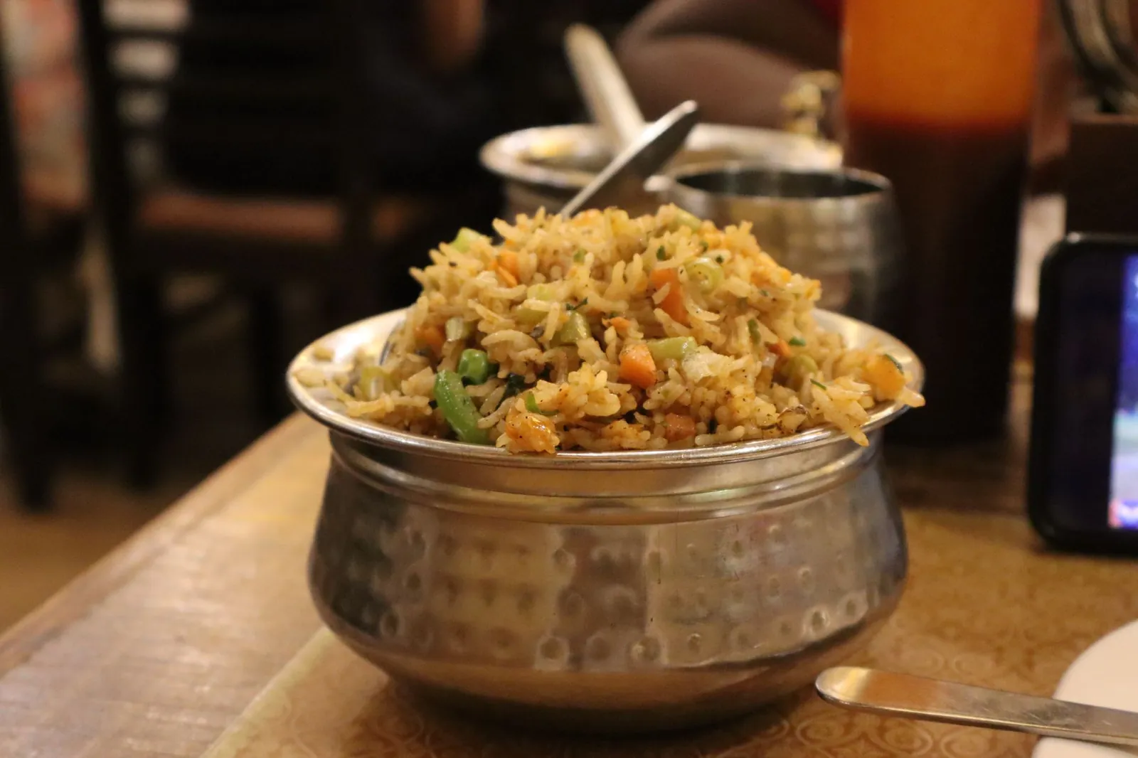 A flavorful serving of Indian fried rice with vegetables in a traditional metal bowl, ideal for food enthusiasts. Stock photo illustrating KRBL's product launched story.