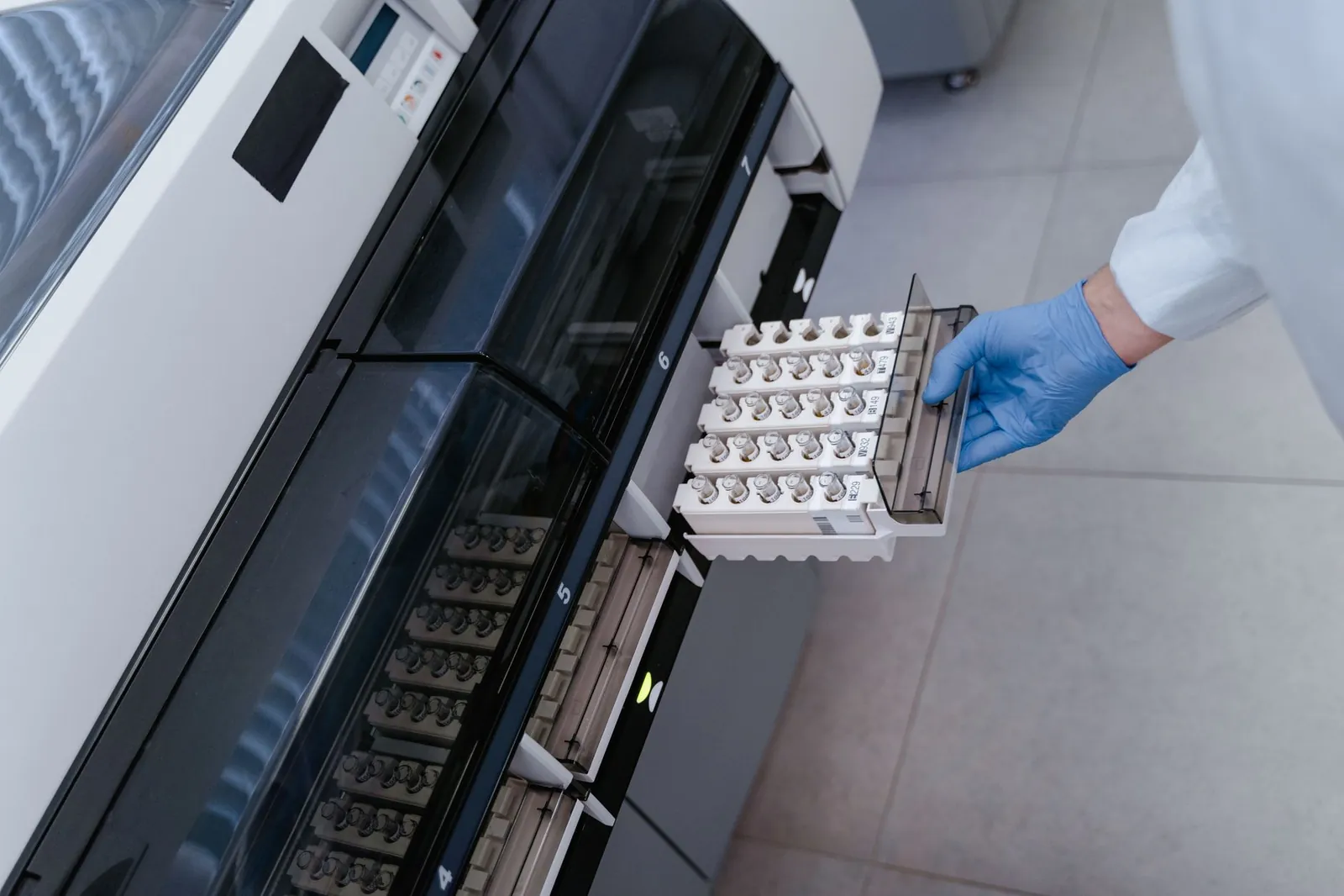 Scientist using advanced lab equipment for research in a modern laboratory setting. Stock photo illustrating Sanjivani Paranteral's fund raise story.