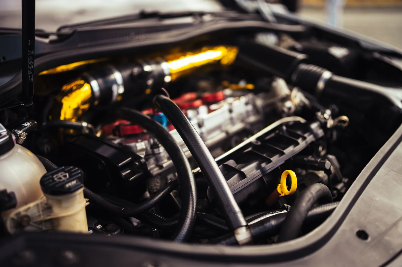 Detailed image of car engine components showcasing automotive engineering and mechanics. Stock photo illustrating Ucal's financial results story.