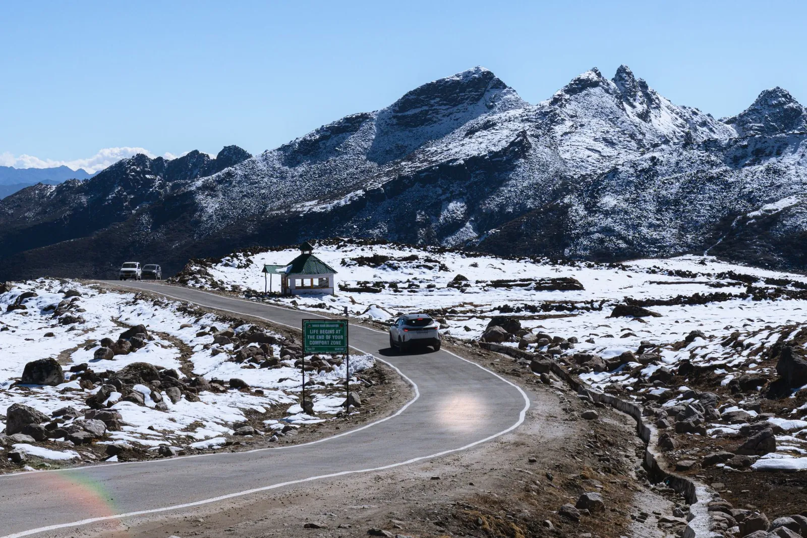 Breathtaking view of a winding road in a snowy mountainous landscape in Tawang, Arunachal Pradesh. Stock photo illustrating Ceigall India's new order story.