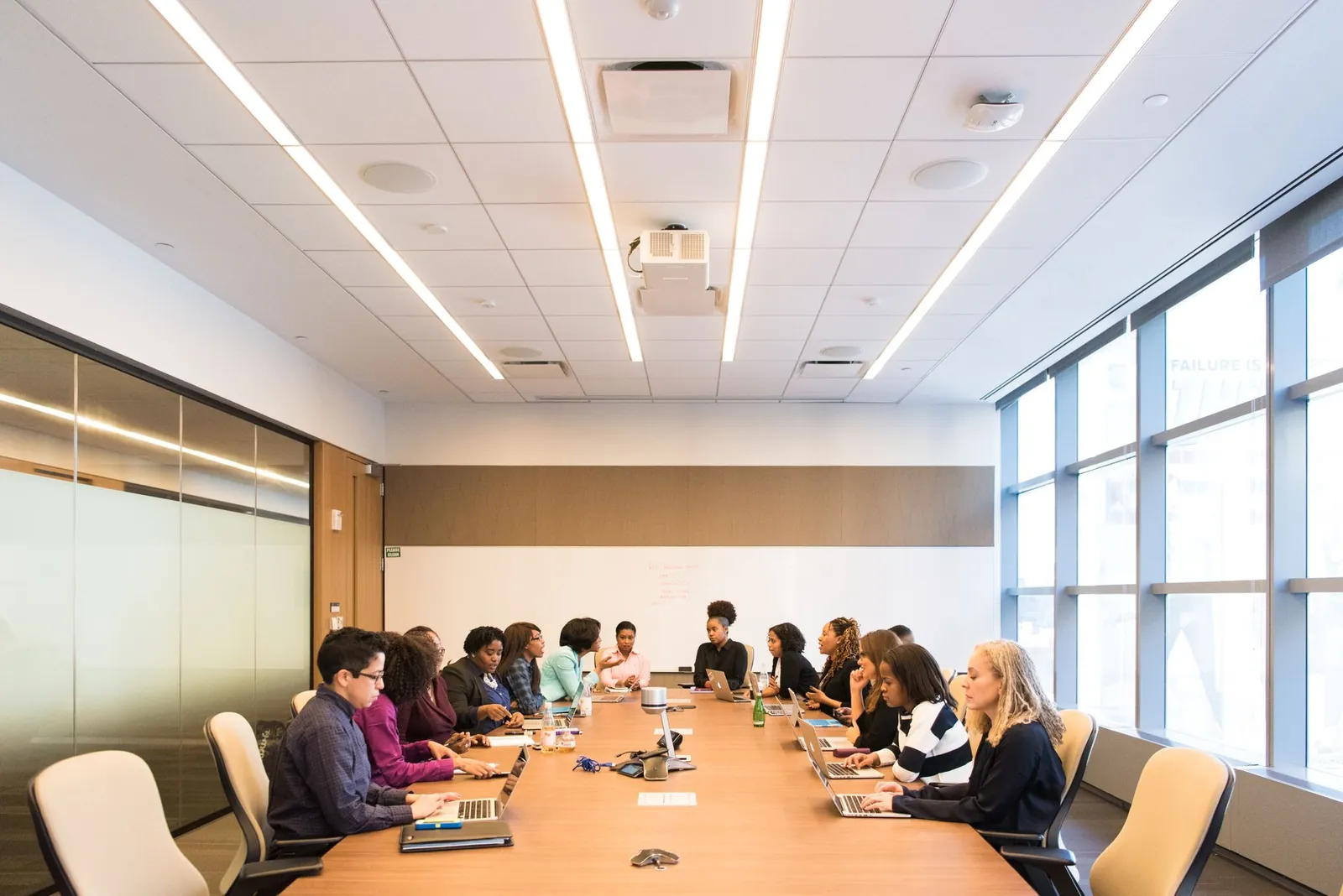 A multicultural team brainstorming and collaborating during a business meeting. Stock photo illustrating Vaxfab Enterprises' fund raise story.