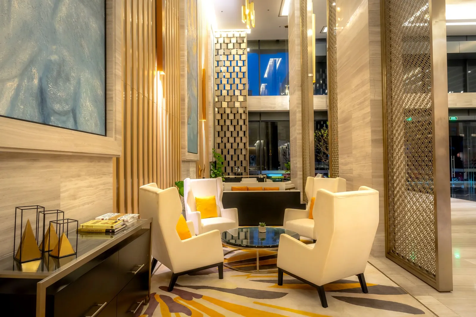 Luxurious hotel lobby featuring comfortable armchairs and sophisticated decor. Stock photo illustrating Oriental Hotels' regulatory approval story.