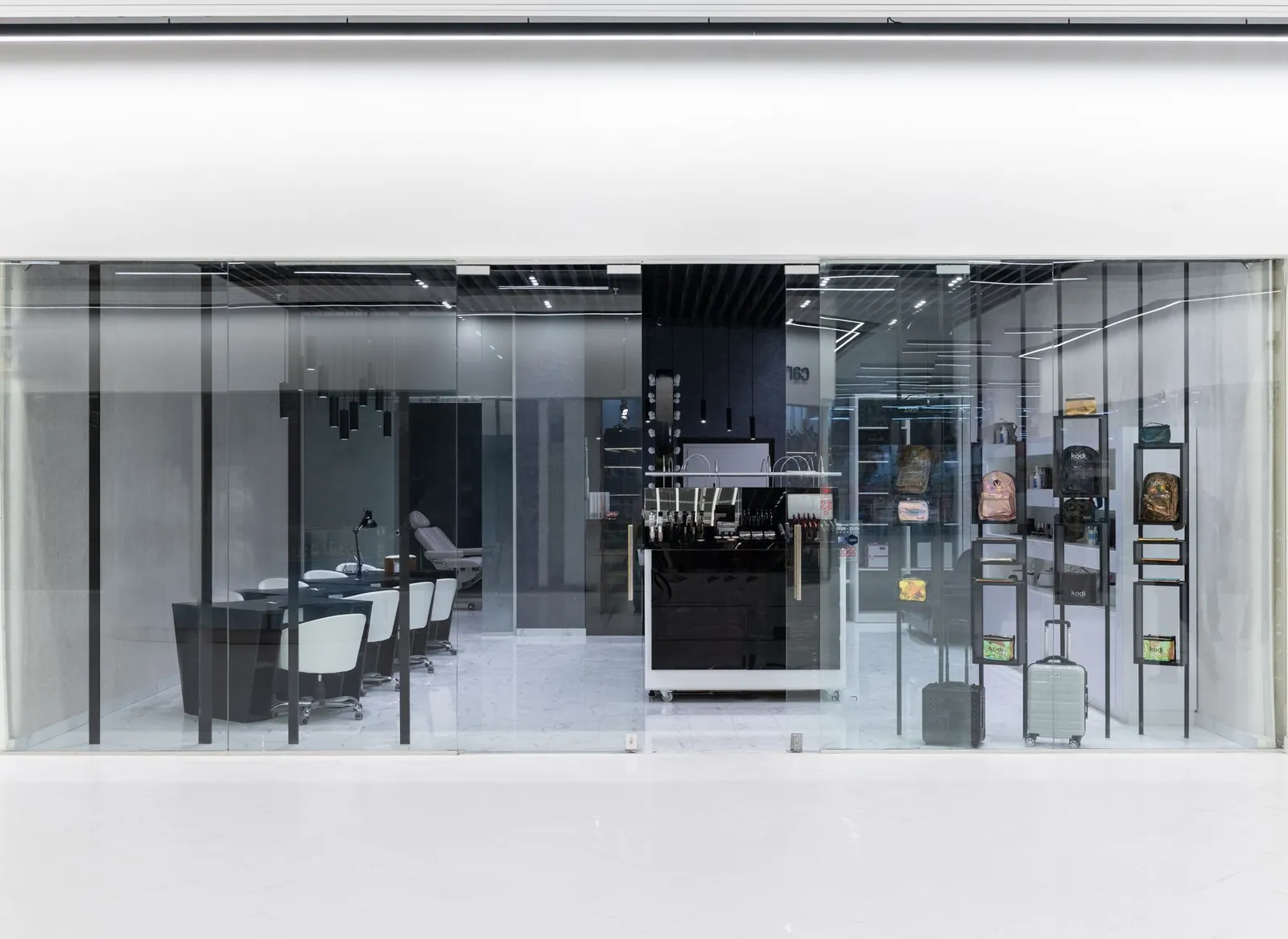 Sleek interior of a modern store with glass facade, stylish furniture, and display items. Stock photo illustrating TCC Concept's expansion story.