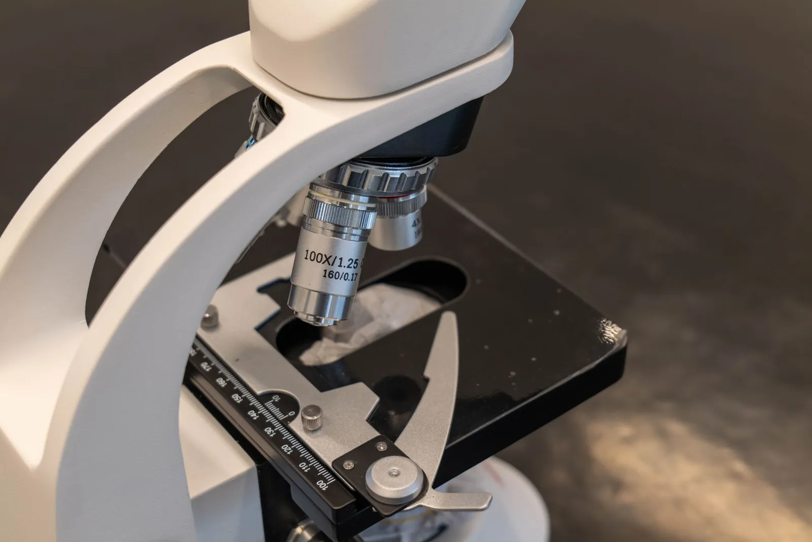 Detailed view of a laboratory microscope, essential for scientific research. Stock photo illustrating International Gemological Institute's earning call story.