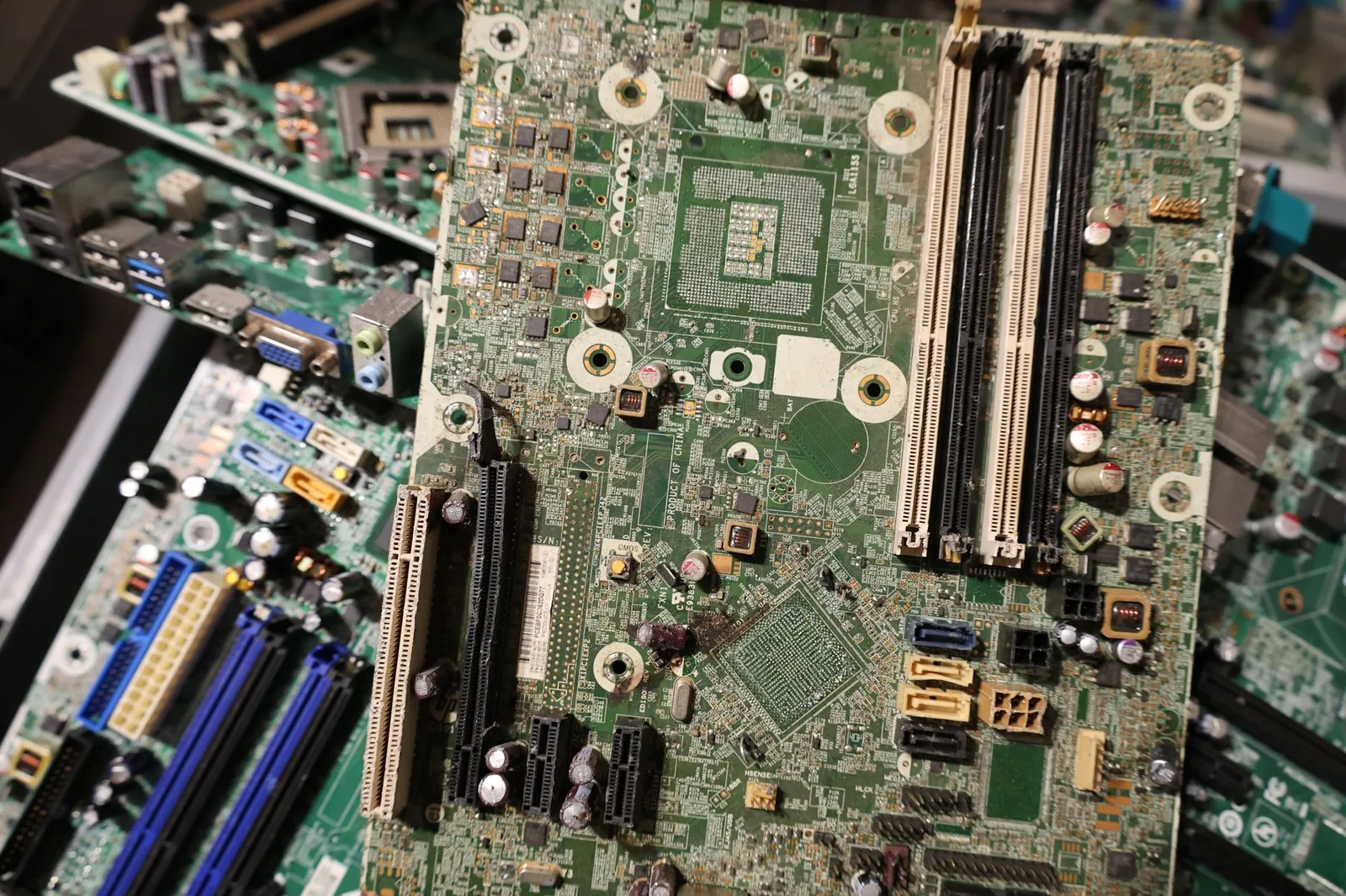 A collection of old circuit boards showcasing electronic waste and recycling possibilities. Stock photo illustrating EPW India's partnership story.