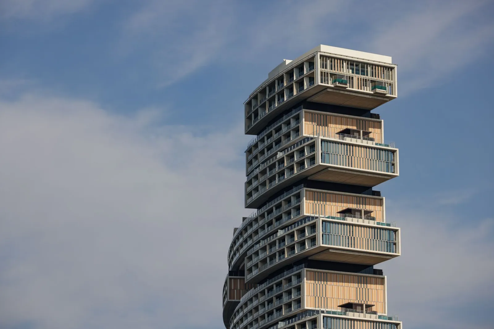 Discover the modern design of a unique high-rise building with stacked apartment modules. Stock photo illustrating Godrej Properties' earning call story.