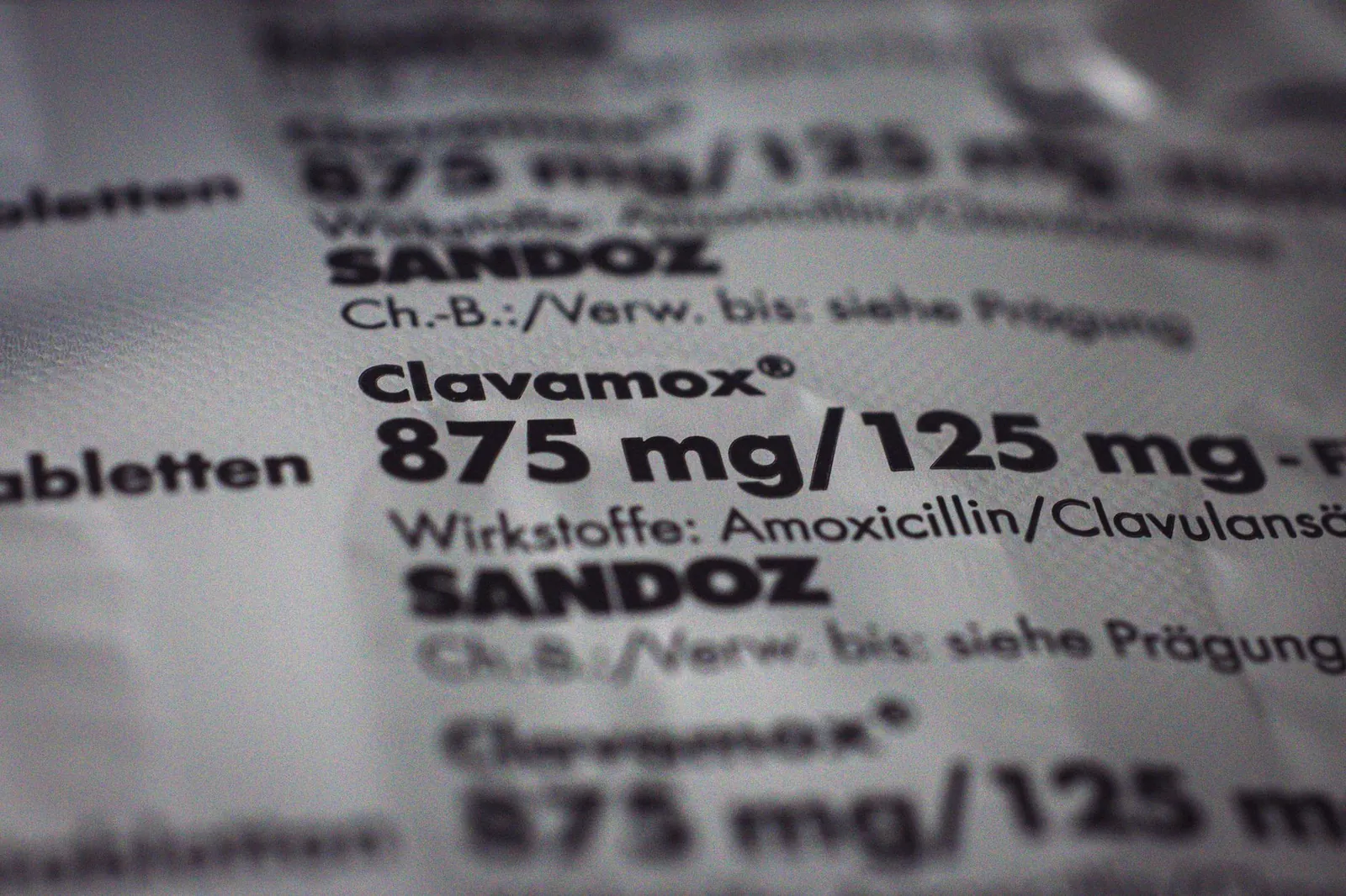 Close-up of a Clavamox package showing dosage and ingredients in focus. Stock photo illustrating Orchid Pharma's partnership story.