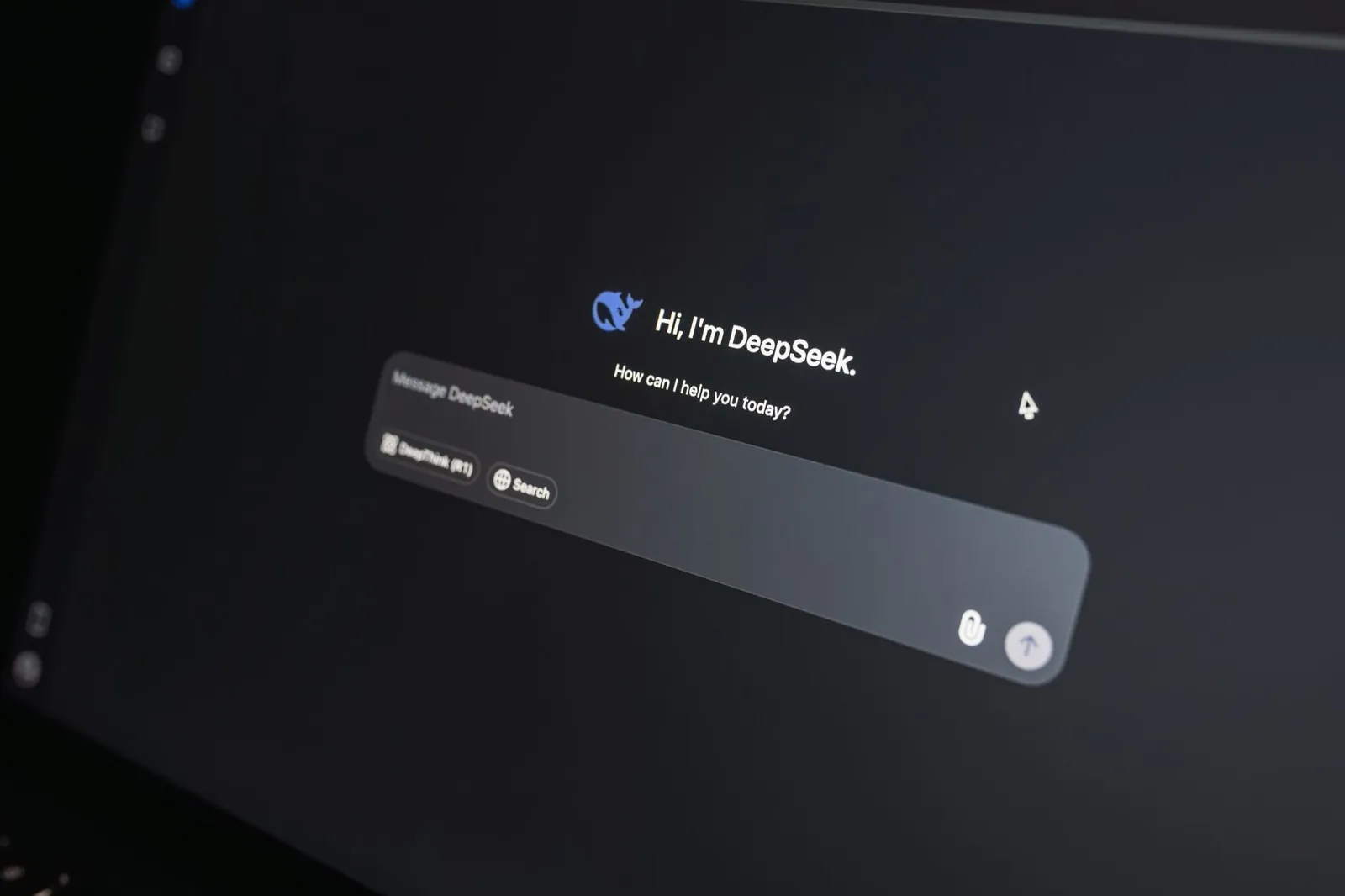 Close-up of DeepSeek AI chat interface on a laptop screen in low light. Stock photo illustrating Coforge's product launched story.