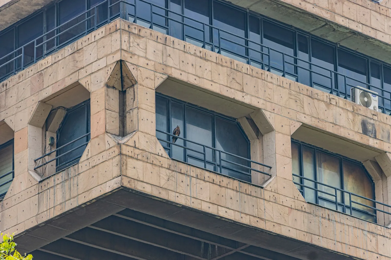 Close-up of a Brutalist building facade in New Delhi, showcasing architectural symmetry. Stock photo illustrating State Bank of India's fund raise story.