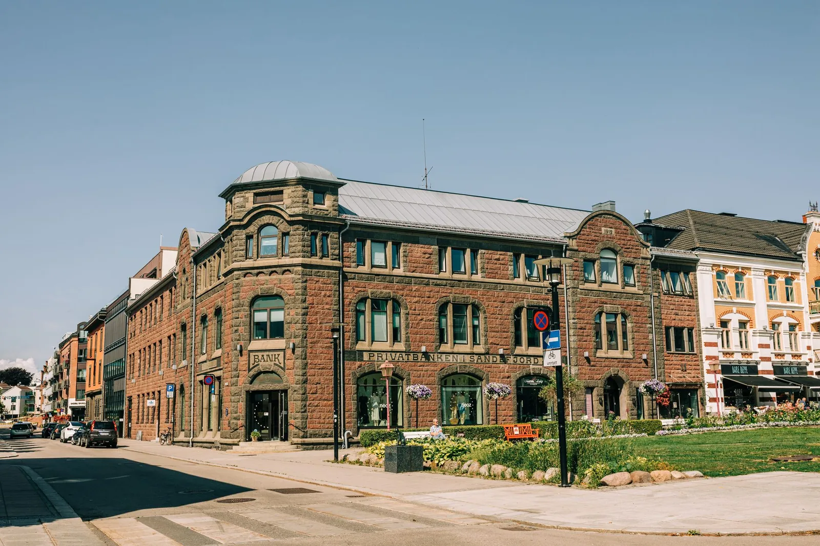 Historic architecture of a private bank building on a sunny city street. Stock photo illustrating ICICI Prudential Asset Management Company's regulatory approval story.