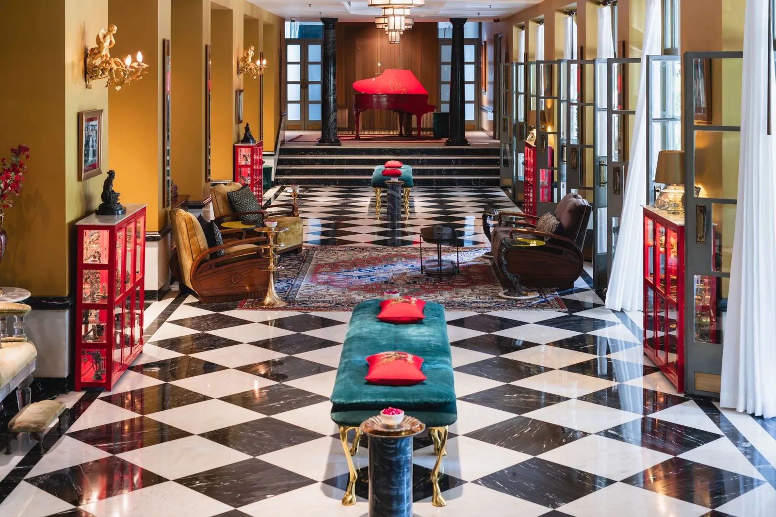 Luxurious hotel lobby in Bikaner, Rajasthan featuring chic interiors and a grand piano. Stock photo illustrating Ethos' expansion story.