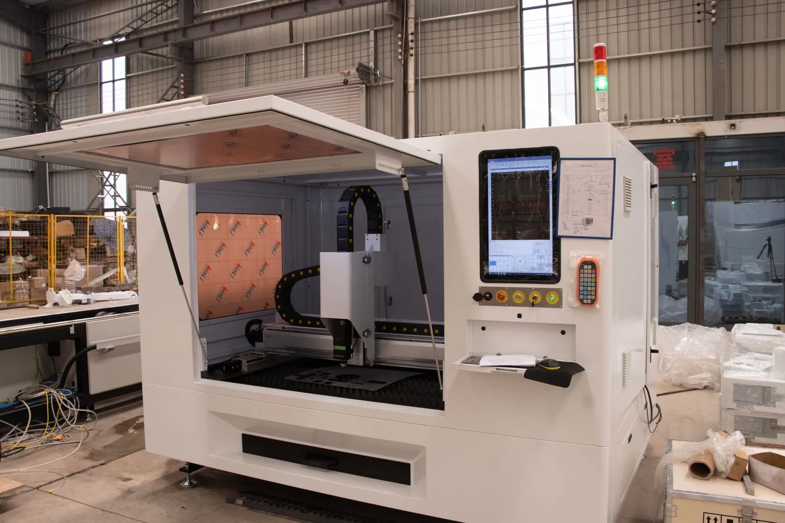 High-tech CNC machine shown in an industrial factory environment, ready for operation. Stock photo illustrating Borosil Renewables' earning call story.
