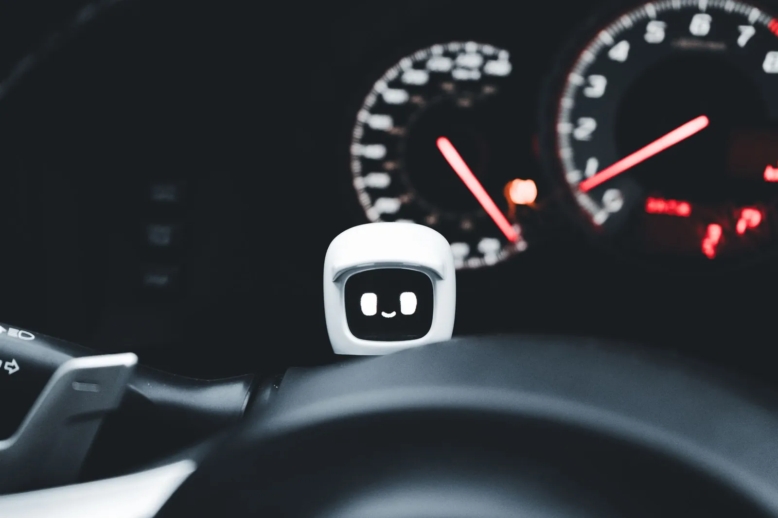 Futuristic smiling robot gadget on a car dashboard symbolizing modern technology and innovation. Stock photo illustrating HCL Technologies' product launched story.