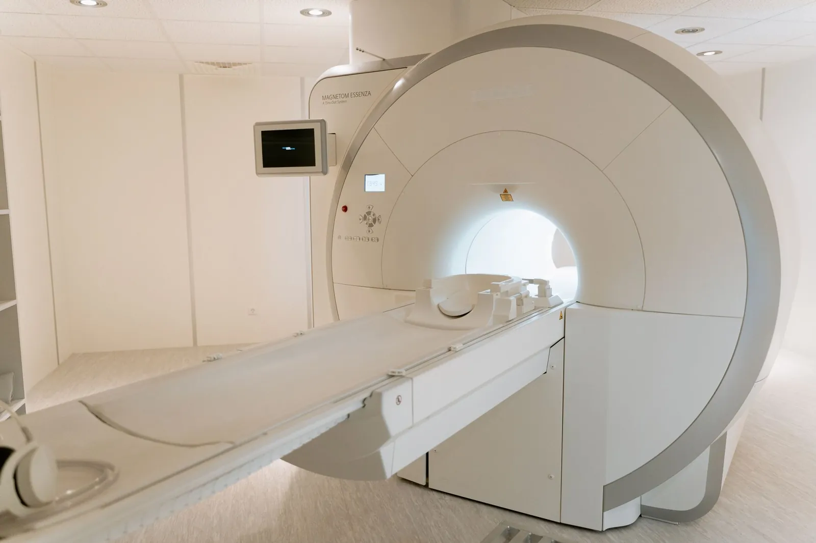 A state-of-the-art MRI scanner in a well-lit hospital room, ready for patient use. Stock photo illustrating Fischer Medical Ventures' product launched story.