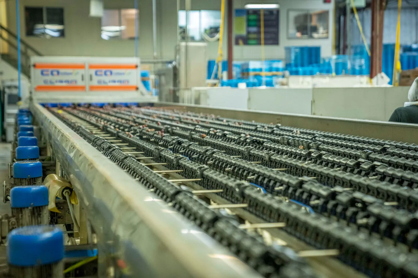 Detailed view of an industrial conveyor belt system used in manufacturing and production settings. Stock photo illustrating Sigma Advanced Systems' new order story.