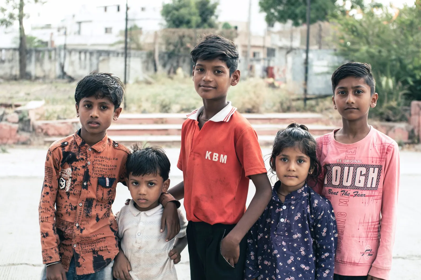 Portrait of a group of children standing outdoors in Indore, India. Stock photo illustrating Iris Clothings' product launched story.