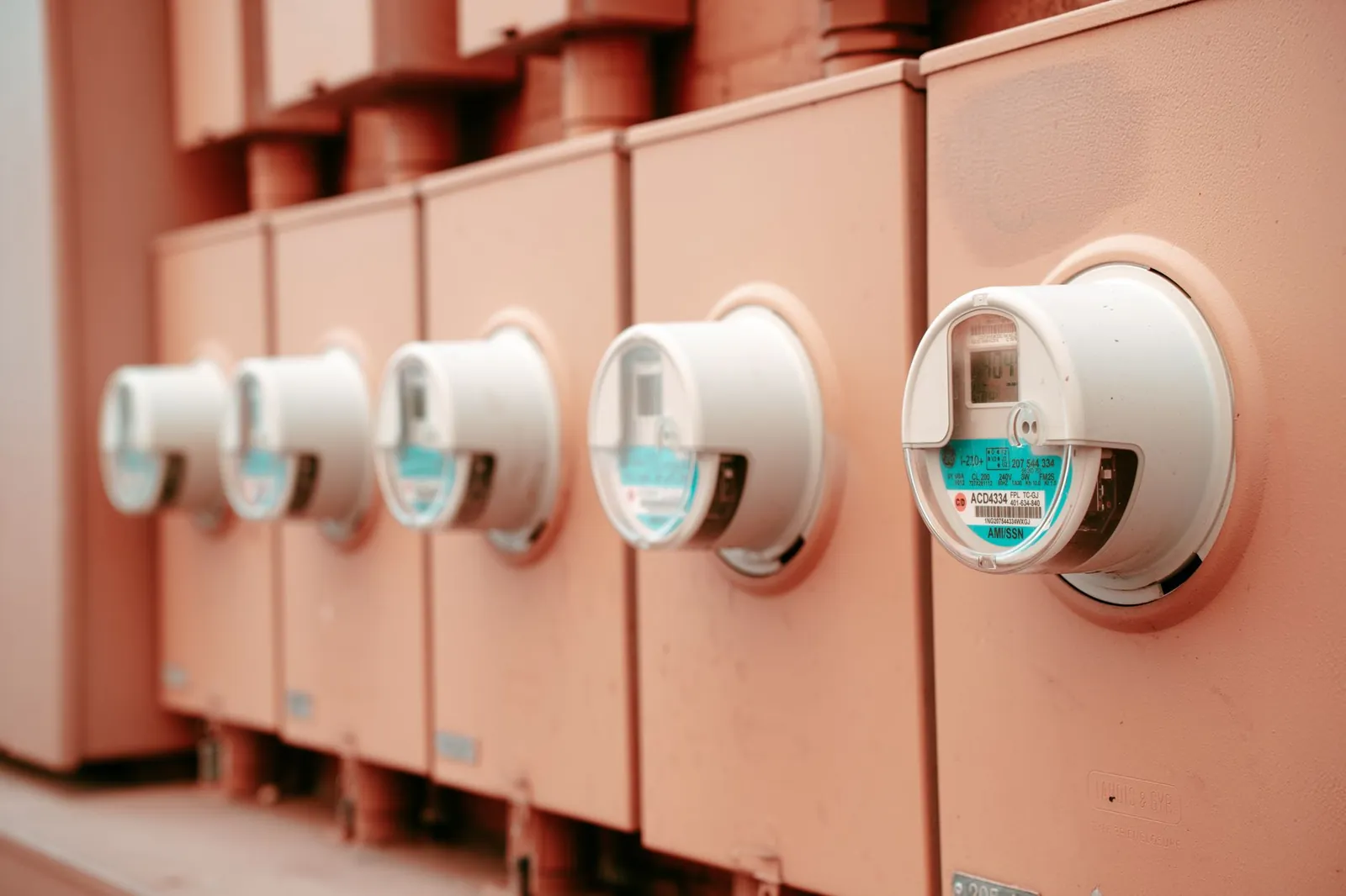 Close-up view of a row of industrial electricity meters for power monitoring and technology. Stock photo illustrating HEC Infra Projects' new order story.