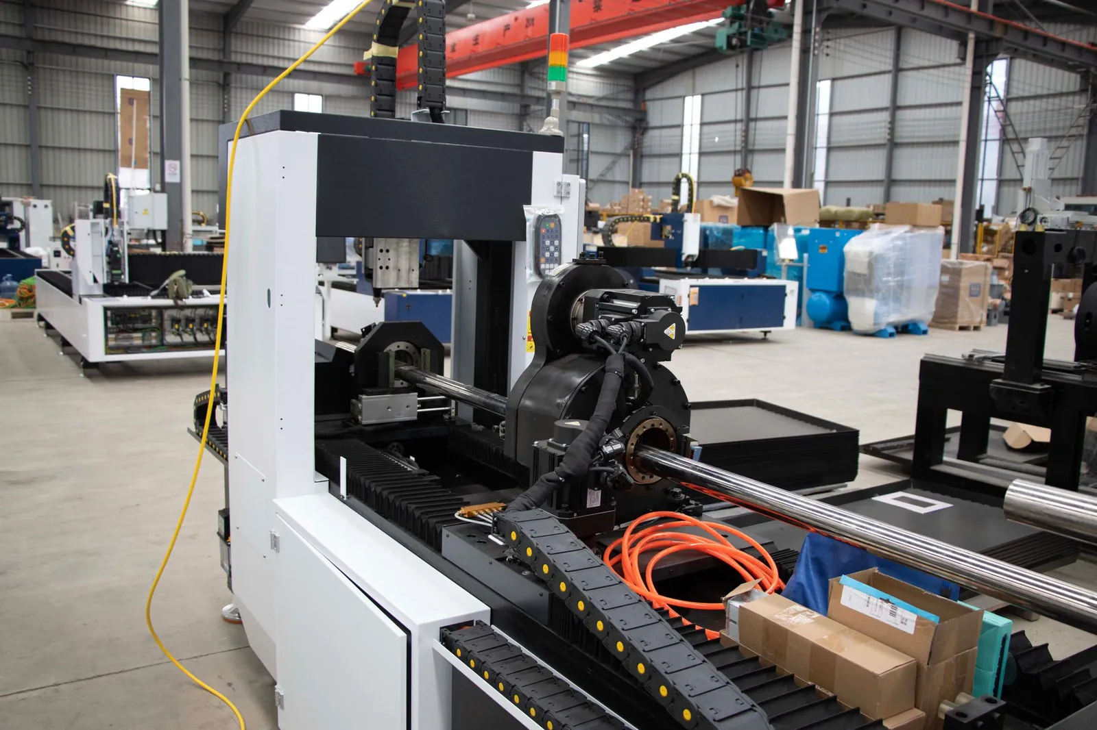 Advanced CNC machine and equipment in a spacious factory environment, showcasing industrial manufacturing. Stock photo illustrating Shivalik Bimetal Controls' production started story.