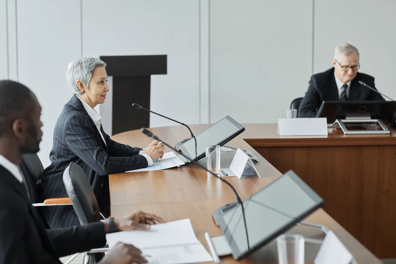 Executives in a conference room engaging in a professional business meeting. Stock photo illustrating IIFL Finance's fund raise story.