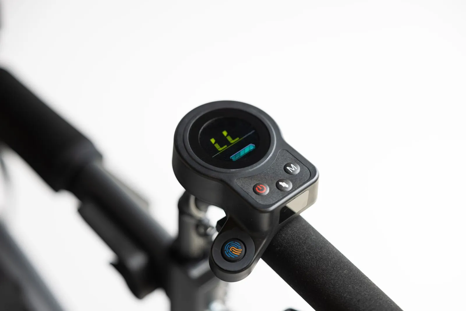 Close-up of electric scooter handlebar featuring digital display and control buttons. Stock photo illustrating Greaves Cotton's product launched story.