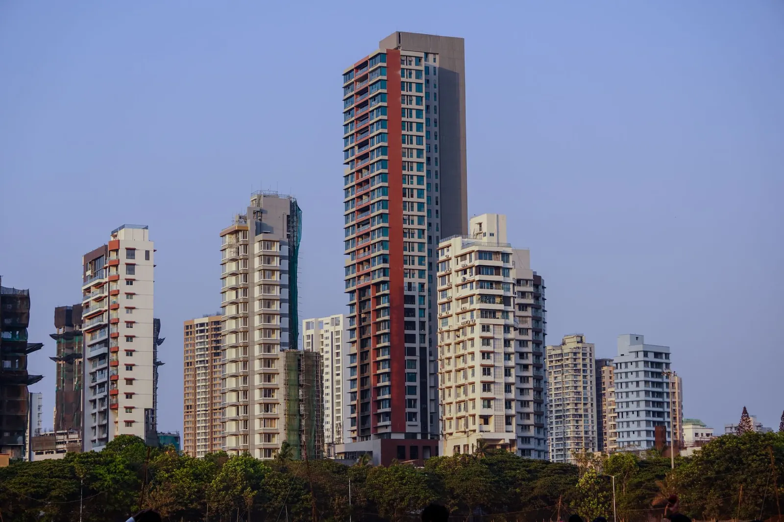 A view of modern residential skyscrapers under a clear blue sky in Mumbai, India. Stock photo illustrating Embassy Developments' new order story.