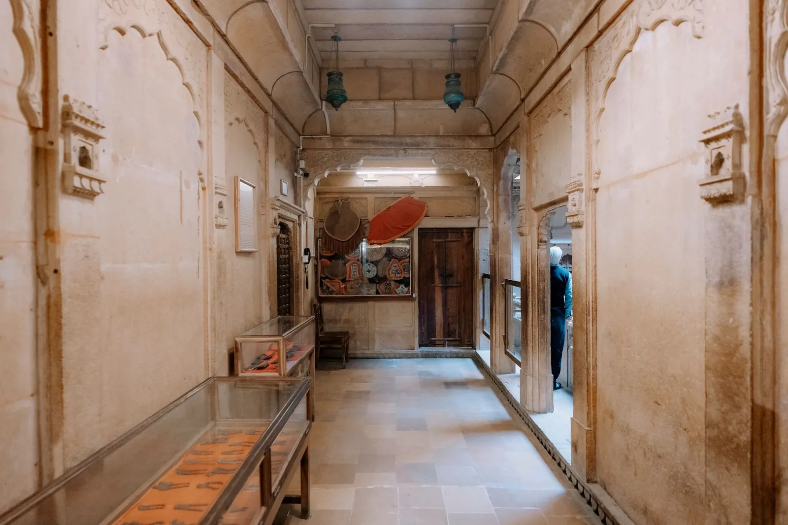 Intricate architecture of Jaisalmer Fort's interior hallway showcasing artifacts. Stock photo illustrating Equitas Small Finance Bank's earning call story.
